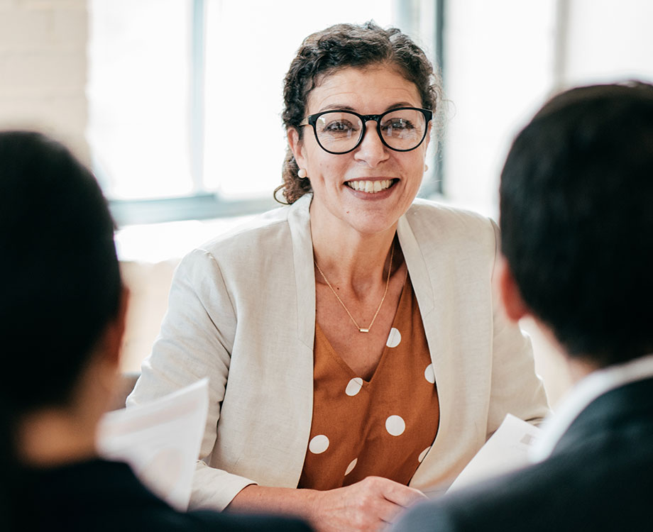 Woman smiling at desk